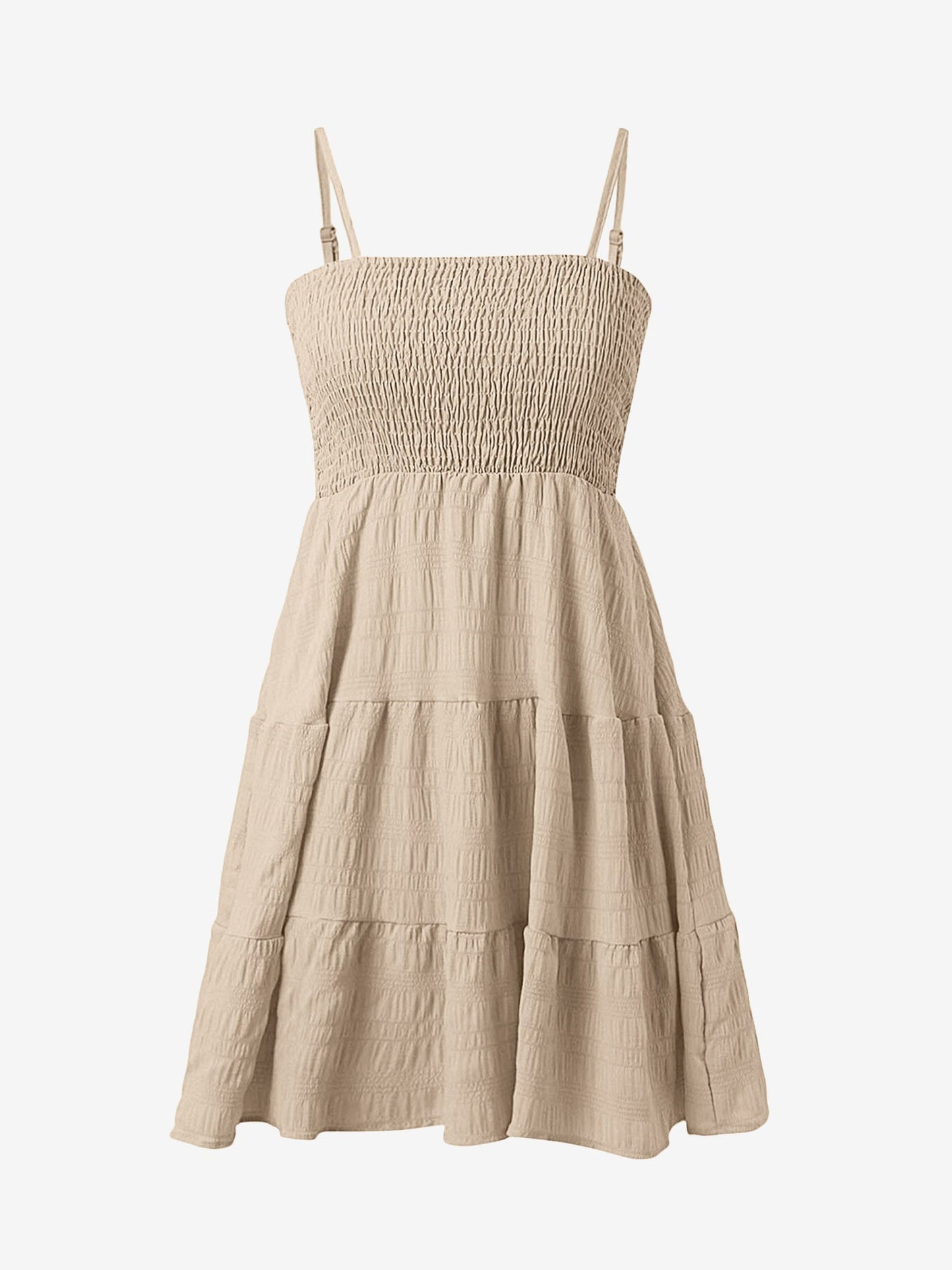 Beige - Woman wearing a textured smocked bodice mini dress with spaghetti straps and a tiered skirt