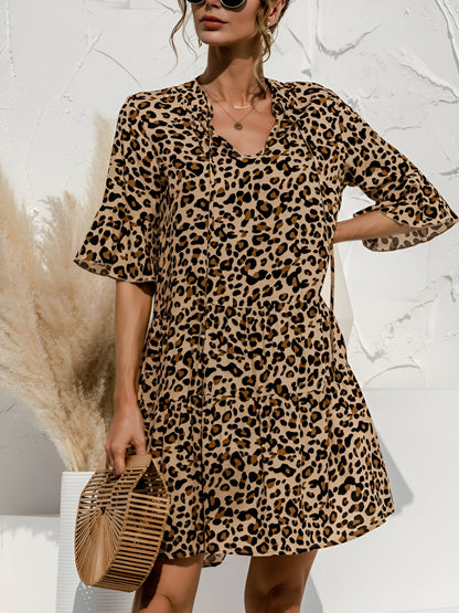 Leopard - Women's lightweight leopard print mini dress featuring a V-neckline with front ties, flared half sleeves, and a tiered skirt.