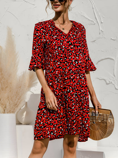 Red - Women's lightweight leopard print mini dress featuring a V-neckline with front ties, flared half sleeves, and a tiered skirt.