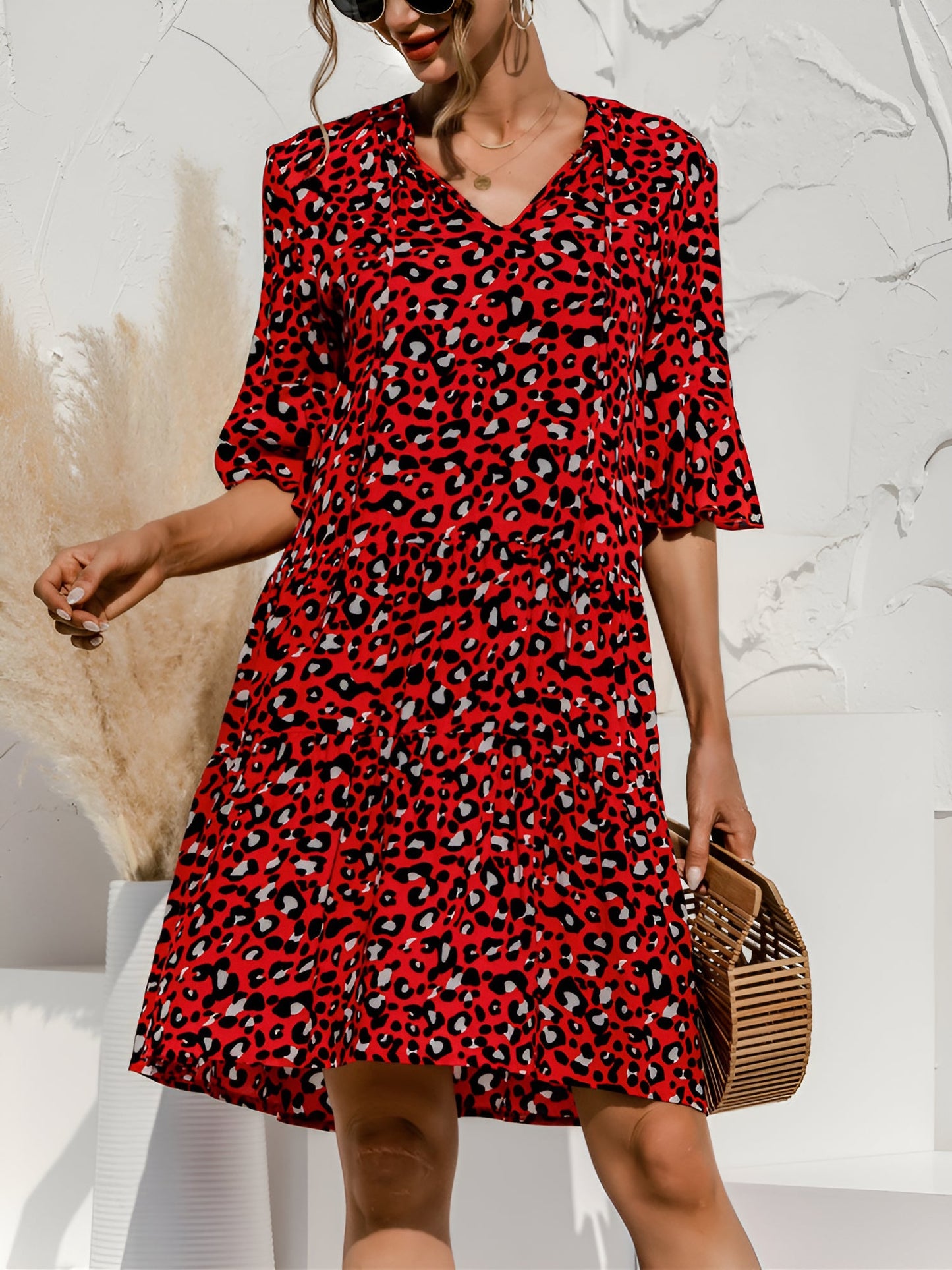 Red - Women's lightweight leopard print mini dress featuring a V-neckline with front ties, flared half sleeves, and a tiered skirt.