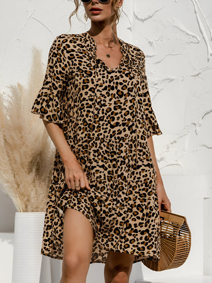 Leopard - Women's lightweight leopard print mini dress featuring a V-neckline with front ties, flared half sleeves, and a tiered skirt.