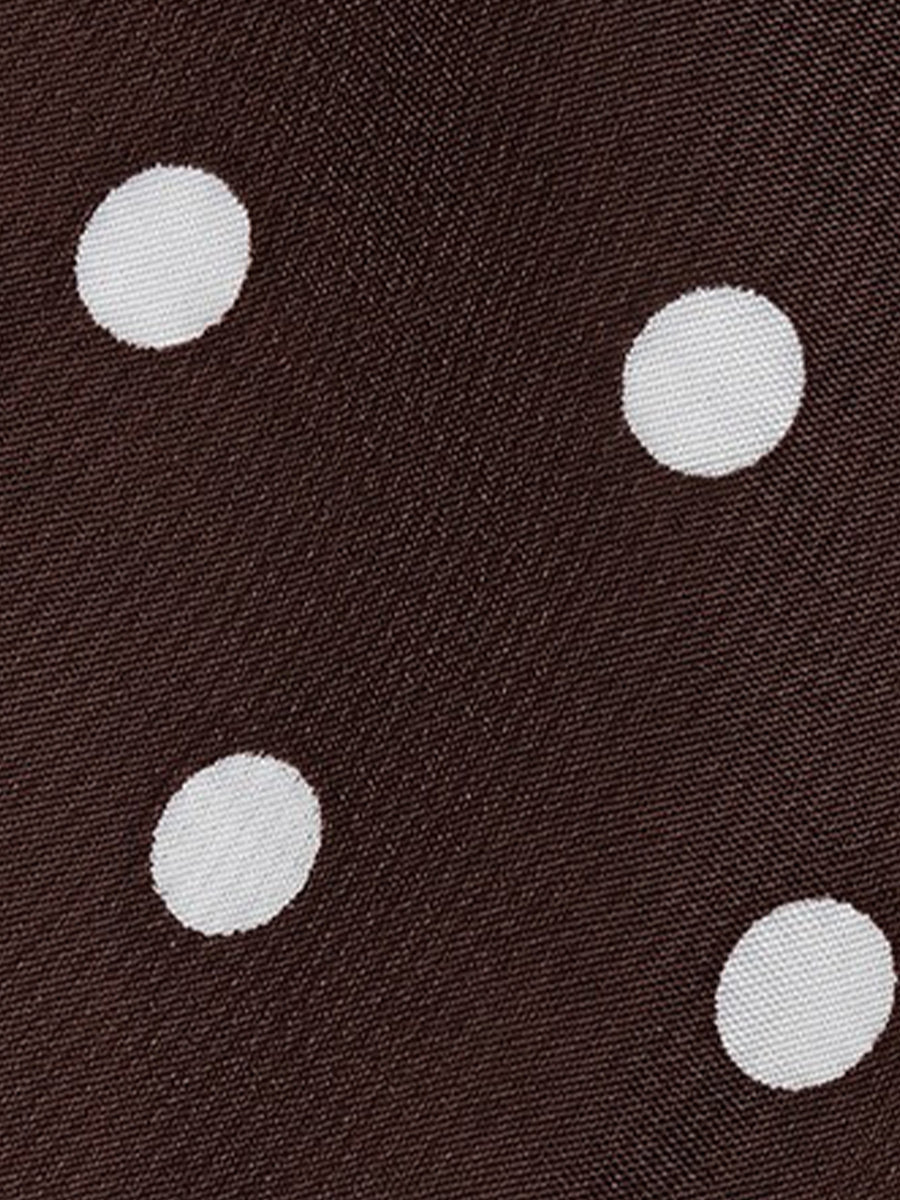 Coffee - Woman modeling a sleeveless halter neck mini dress with a polka dot print and blouson top
