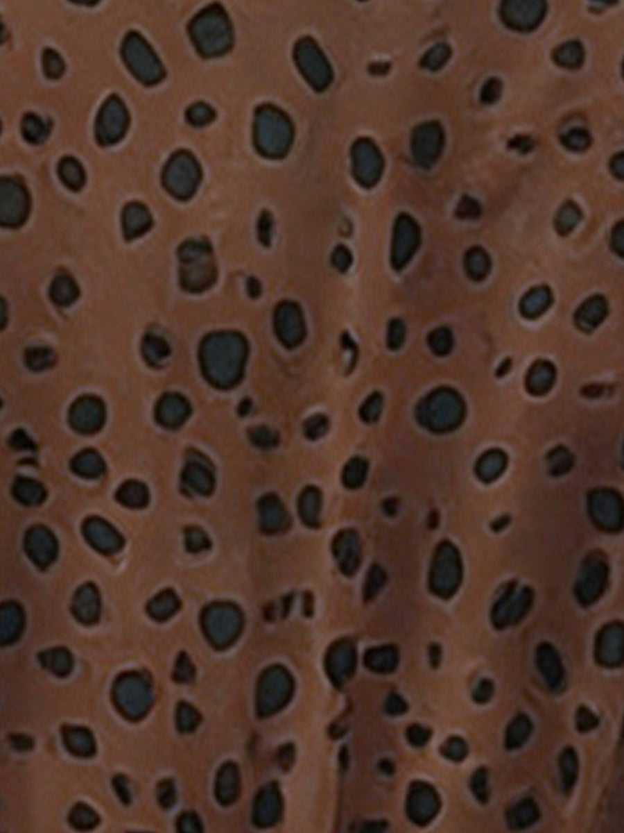 Leopard - Woman wearing a polka dot V-neck midi dress with a tie waist and a tiered skirt featuring side pockets.