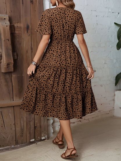 Leopard - Woman wearing a polka dot V-neck midi dress with a tie waist and a tiered skirt featuring side pockets.