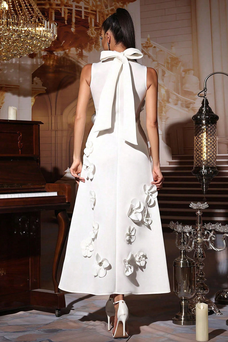 White - Sleeveless high neck maxi dress featuring a structured column silhouette and cascading dimensional floral appliques across the front bodice and skirt.