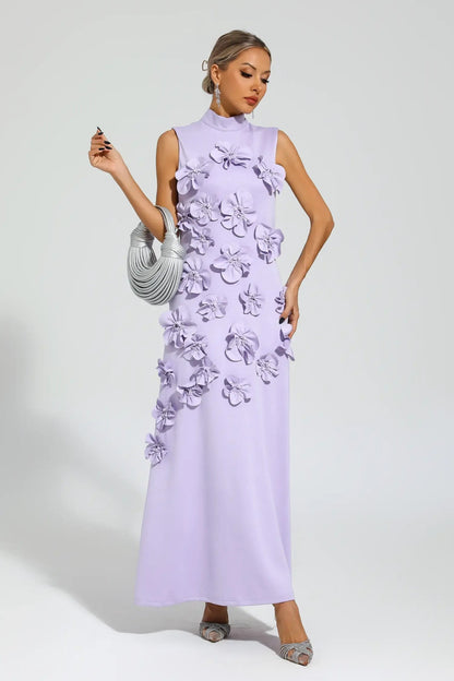 White - Sleeveless high neck maxi dress featuring a structured column silhouette and cascading dimensional floral appliques across the front bodice and skirt.
