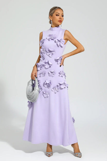 White - Sleeveless high neck maxi dress featuring a structured column silhouette and cascading dimensional floral appliques across the front bodice and skirt.
