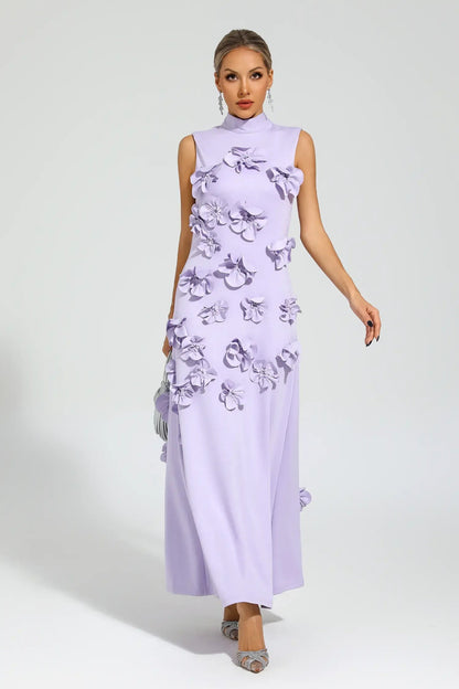 White - Sleeveless high neck maxi dress featuring a structured column silhouette and cascading dimensional floral appliques across the front bodice and skirt.
