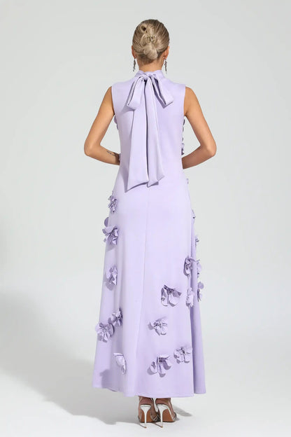 Purple - Sleeveless high neck maxi dress featuring a structured column silhouette and cascading dimensional floral appliques across the front bodice and skirt.