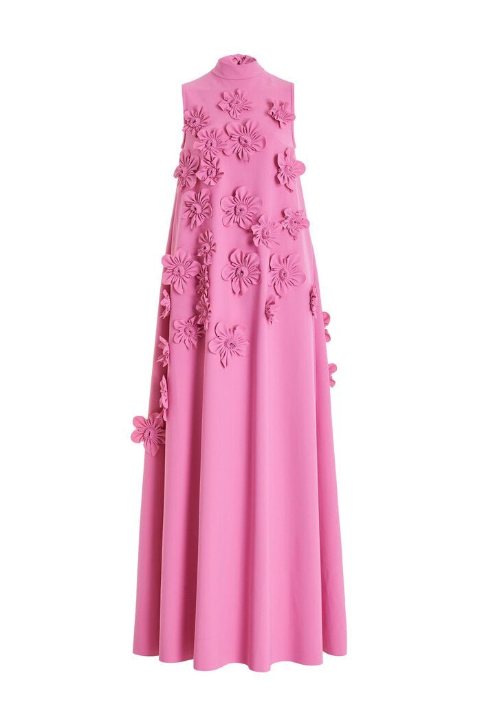 Pink - Sleeveless high neck maxi dress featuring a structured column silhouette and cascading dimensional floral appliques across the front bodice and skirt.