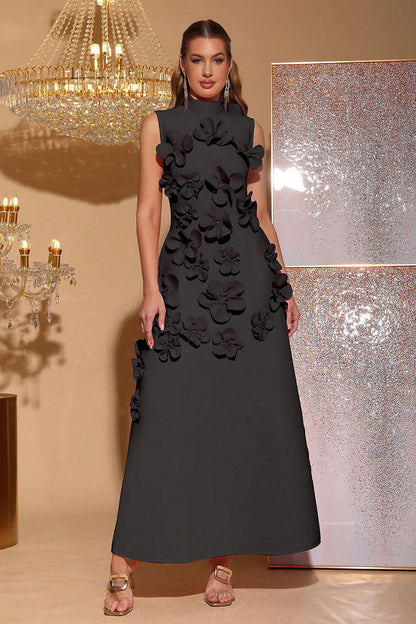Black - Sleeveless high neck maxi dress featuring a structured column silhouette and cascading dimensional floral appliques across the front bodice and skirt.