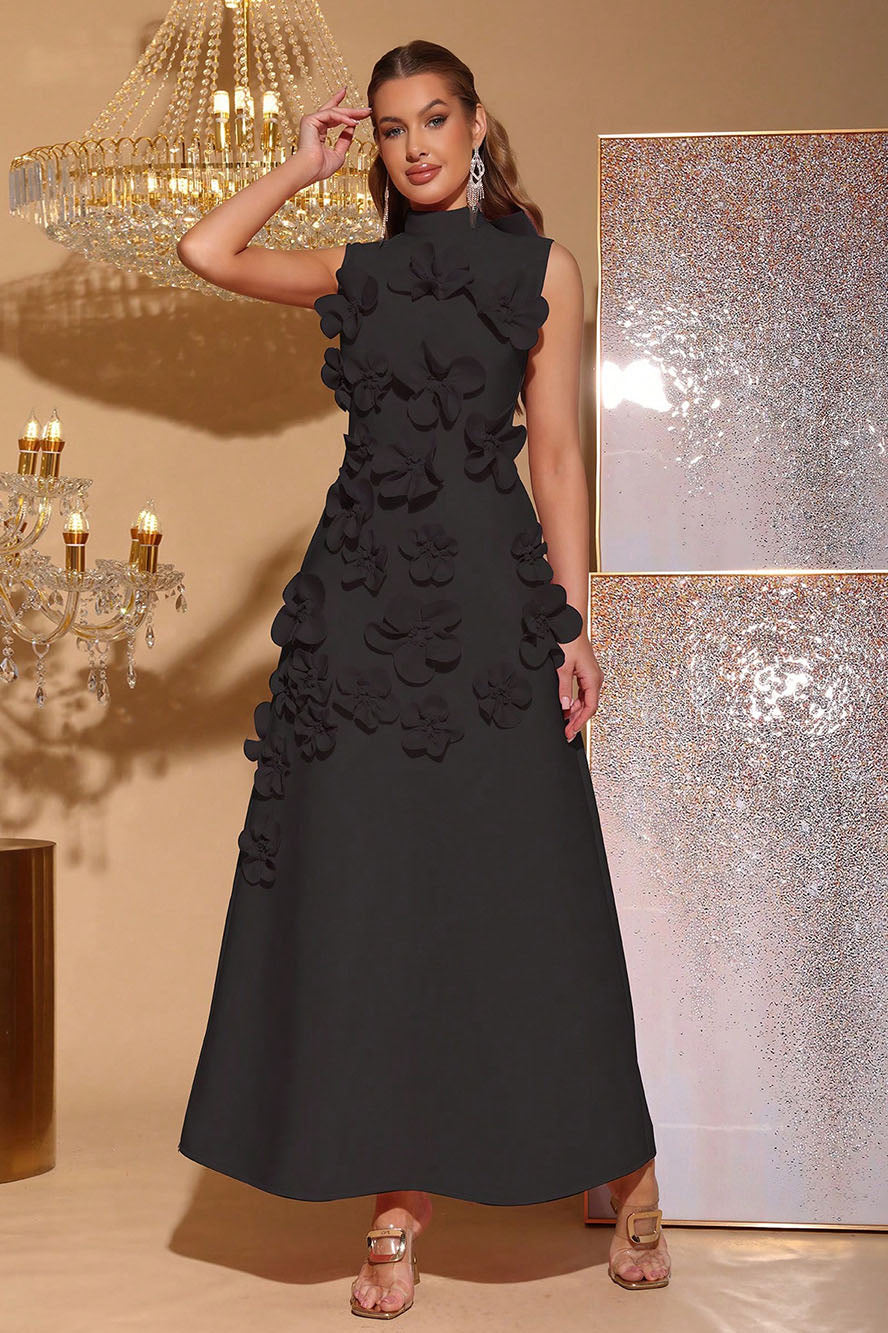 Black - Sleeveless high neck maxi dress featuring a structured column silhouette and cascading dimensional floral appliques across the front bodice and skirt.