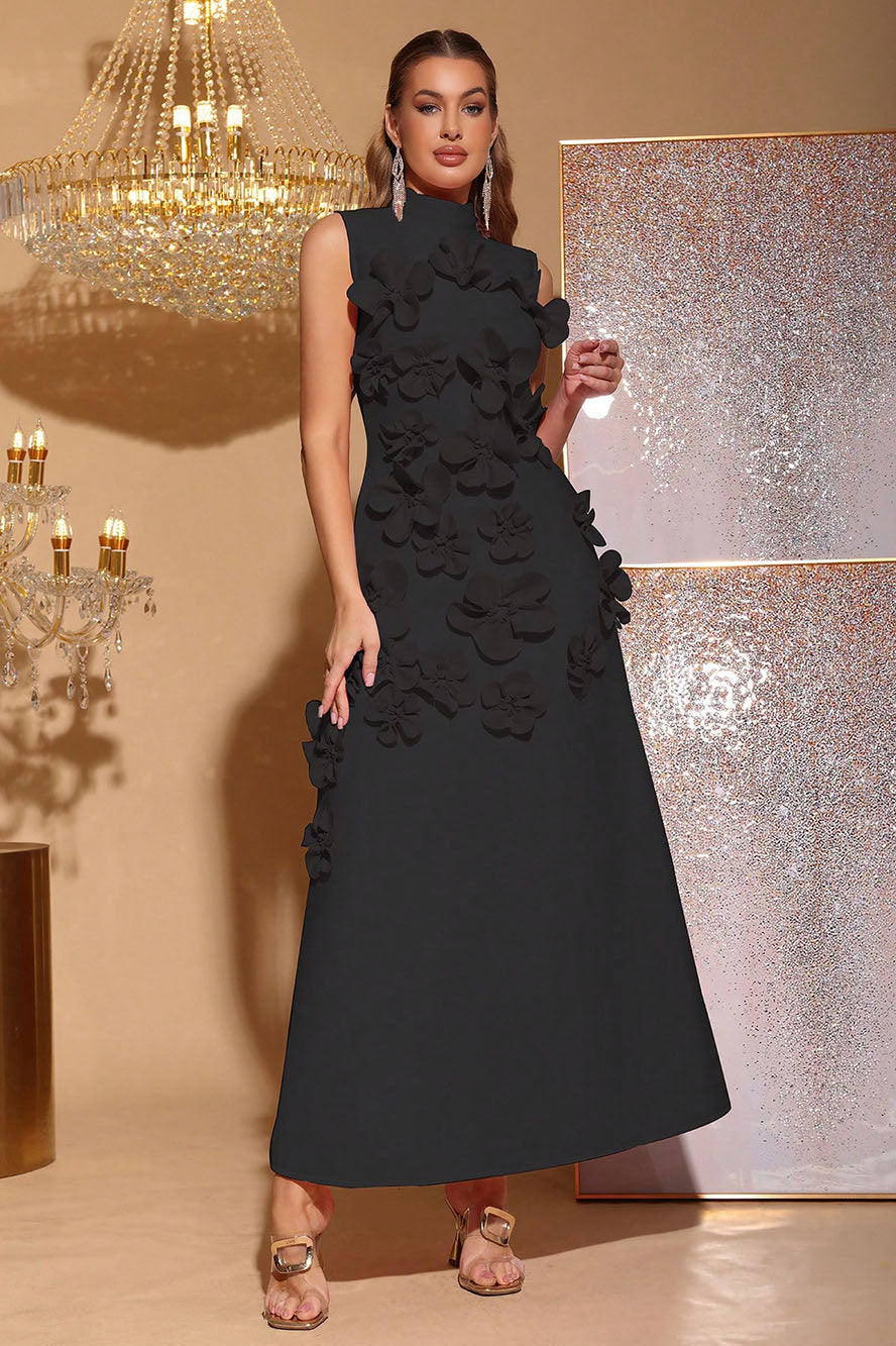 Black - Sleeveless high neck maxi dress featuring a structured column silhouette and cascading dimensional floral appliques across the front bodice and skirt.