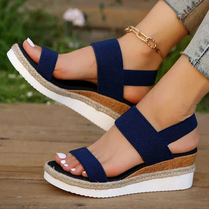 Blue - Women's open-toe platform sandals featuring woven elastic straps, a cushioned footbed, and espadrille jute trim on a thick shock-absorbing sole.