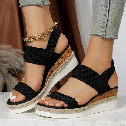 Black (Almost sold out) - Women's open-toe platform sandals featuring woven elastic straps, a cushioned footbed, and espadrille jute trim on a thick shock-absorbing sole.