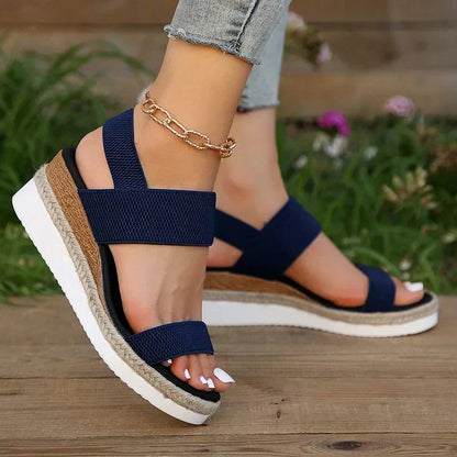 Pink - Women's open-toe platform sandals featuring woven elastic straps, a cushioned footbed, and espadrille jute trim on a thick shock-absorbing sole.