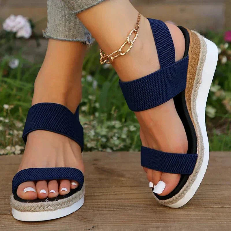 Pink - Women's open-toe platform sandals featuring woven elastic straps, a cushioned footbed, and espadrille jute trim on a thick shock-absorbing sole.
