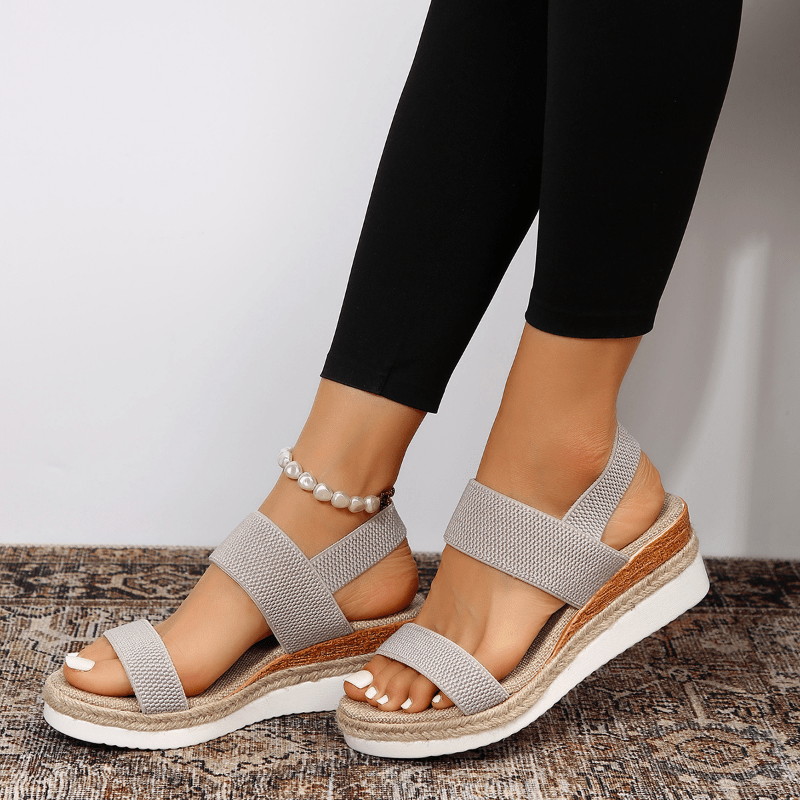 Pink - Women's open-toe platform sandals featuring woven elastic straps, a cushioned footbed, and espadrille jute trim on a thick shock-absorbing sole.