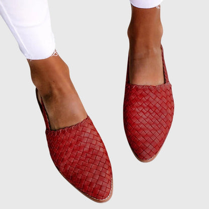 Red - Women's woven faux-leather slip-on flat loafers featuring an almond toe and textured upper design.