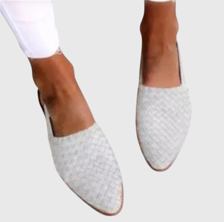 White - Women's woven faux-leather slip-on flat loafers featuring an almond toe and textured upper design.