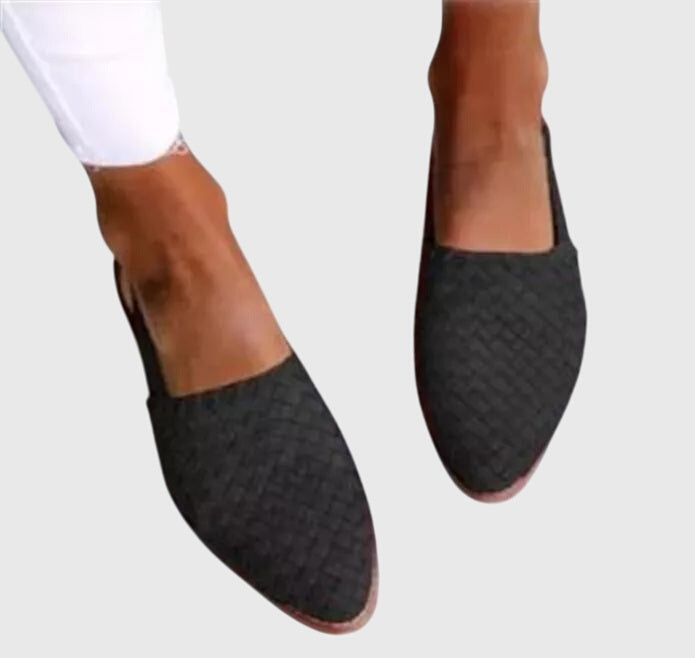 Black - Women's woven faux-leather slip-on flat loafers featuring an almond toe and textured upper design.