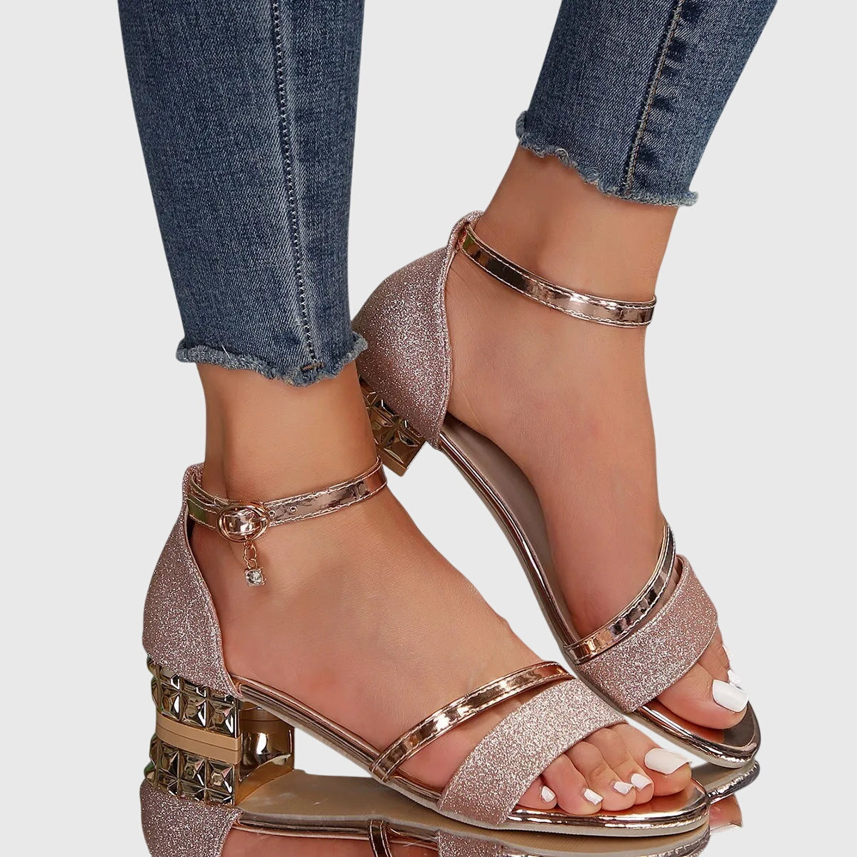 Black - Women's open toe dress sandals featuring a textured front strap, adjustable ankle buckle, and a low architectural metallic block heel.