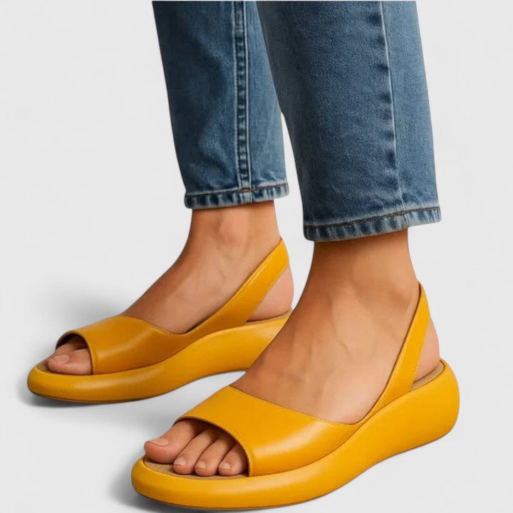 Yellow - Faux-leather platform sandals featuring a wide front strap, open toe, and a continuous slingback strap on a thick cushioned sole.