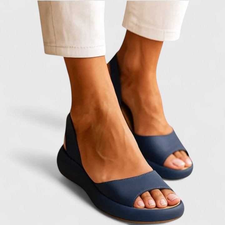 Blue - Faux-leather platform sandals featuring a wide front strap, open toe, and a continuous slingback strap on a thick cushioned sole.