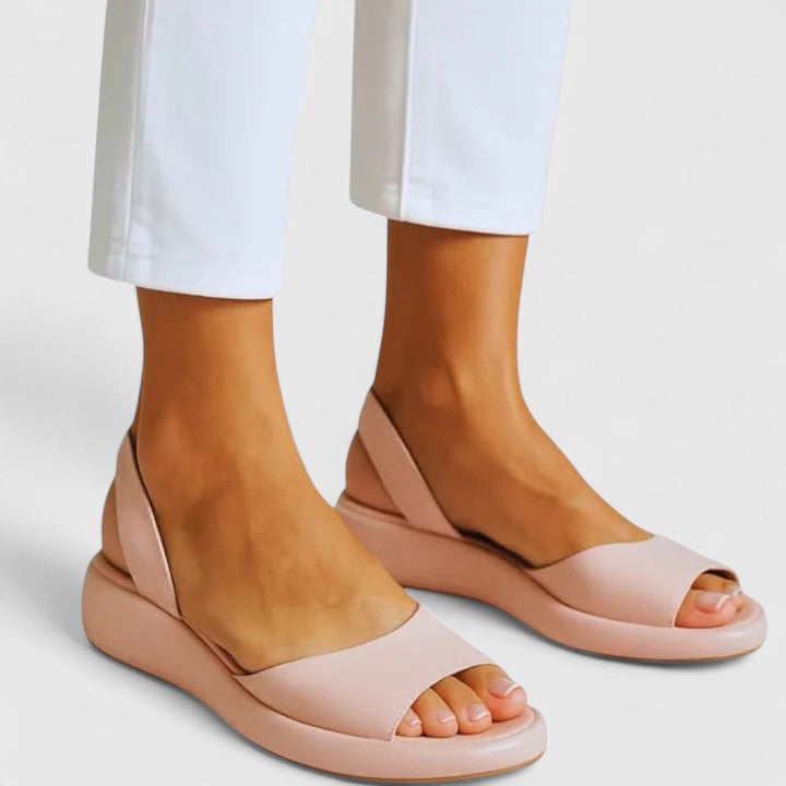 Pink - Faux-leather platform sandals featuring a wide front strap, open toe, and a continuous slingback strap on a thick cushioned sole.