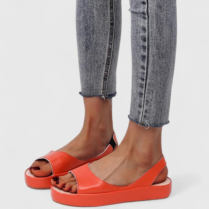 Pink - Faux-leather platform sandals featuring a wide front strap, open toe, and a continuous slingback strap on a thick cushioned sole.