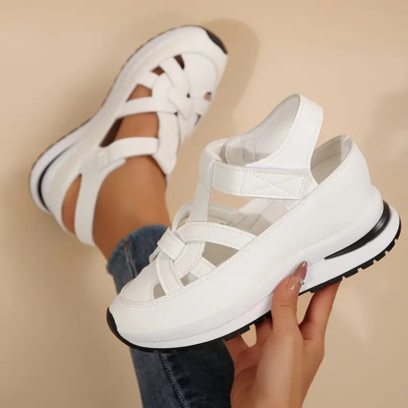 Black - Women's faux-leather orthopedic platform sandals featuring a woven cut-out upper design, adjustable heel strap, and thick cushioned sole, modeled on feet.