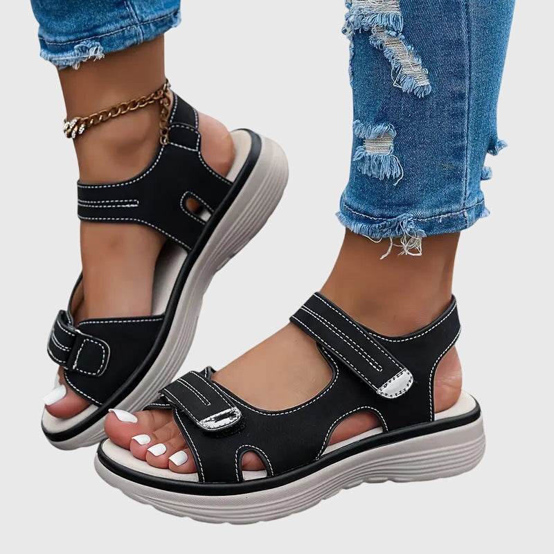 Black - Women's faux-leather platform sandals featuring dual hook-and-loop adjustable straps, contrast stitching details, and a thick shock-absorbing sole.