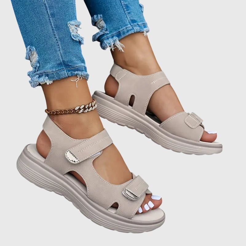Black - Women's faux-leather platform sandals featuring dual hook-and-loop adjustable straps, contrast stitching details, and a thick shock-absorbing sole.