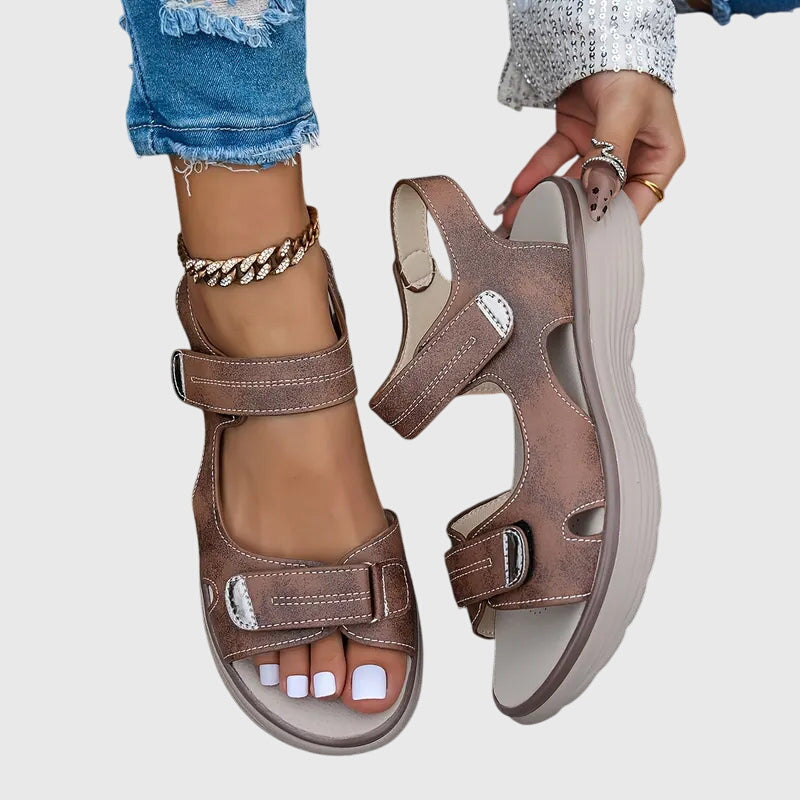 Black - Women's faux-leather platform sandals featuring dual hook-and-loop adjustable straps, contrast stitching details, and a thick shock-absorbing sole.