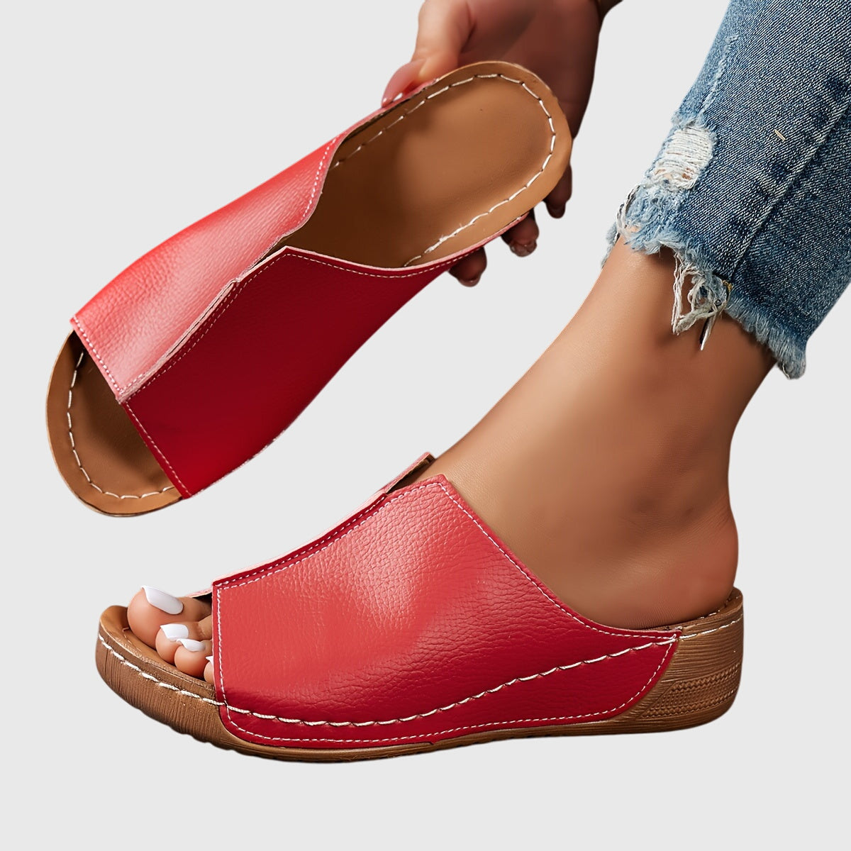 Black - Women's faux-leather slip-on wedge sandals featuring an open-toe design, contoured footbed, and detailed contrast stitching along the sole.