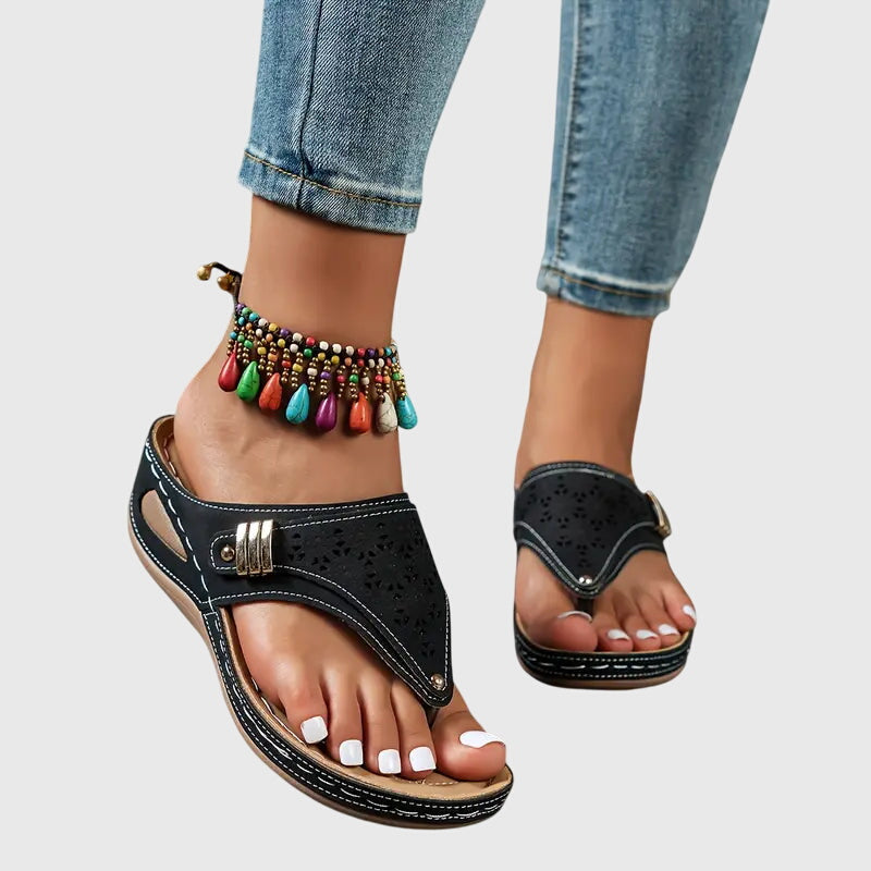 Khaki - Faux-leather wedge sandals featuring a slip-on thong design, laser-cut upper detailing, decorative metallic buckle, and prominent contrast stitching along a thick shock-absorbing sole.