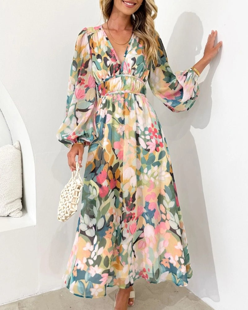 XL - A woman wearing a long-sleeved watercolor floral print chiffon maxi dress with a plunging V-neckline, ruched waistband, and balloon sleeves.