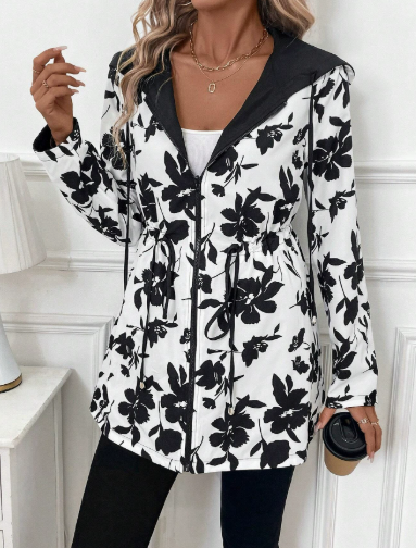 White - Women's mid-length red zip-up anorak jacket worn open to reveal a bold leopard print interior lining, featuring front pockets and an internal drawstring waist.