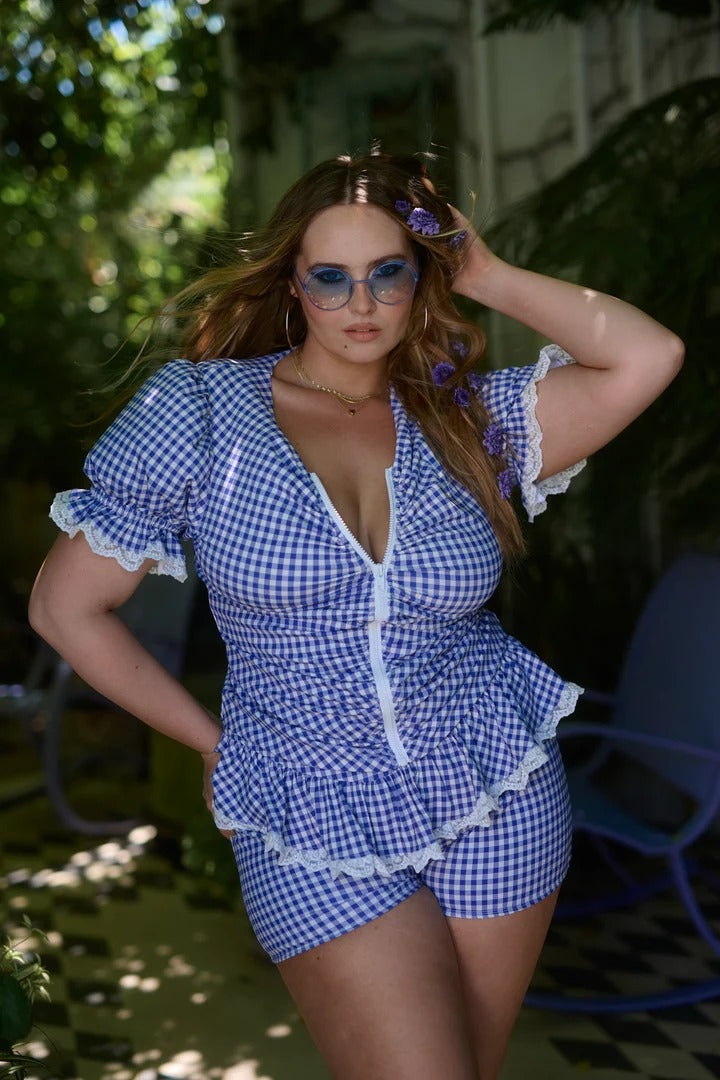 Blue - Women's retro-style gingham playsuit featuring a zip-front ruched bodice, short sleeves with lace trim, and a ruffled peplum over fitted shorts.