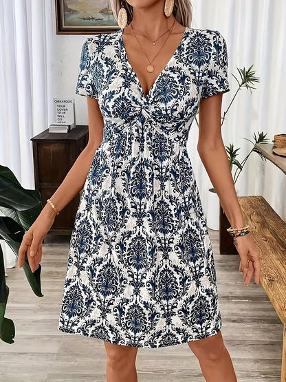Blue - Woman wearing a short sleeve leopard print mini dress with a V-neckline and twist detail at the bust.