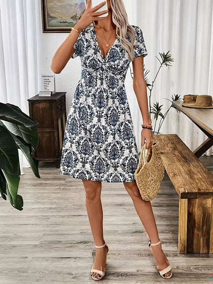 Blue - Woman wearing a short sleeve leopard print mini dress with a V-neckline and twist detail at the bust.