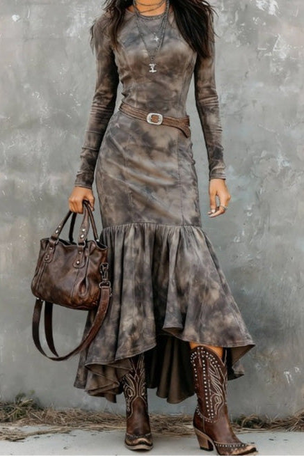 Grey - A woman wearing a long-sleeved, crewneck mini dress in a brown and grey tie-dye pattern, featuring vertical seams and a fitted silhouette.