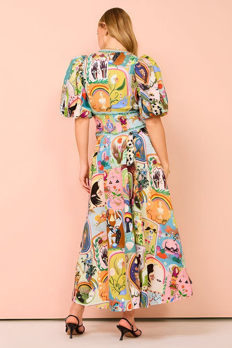 Woman in colorful printed cotton midi dress with puff sleeves
