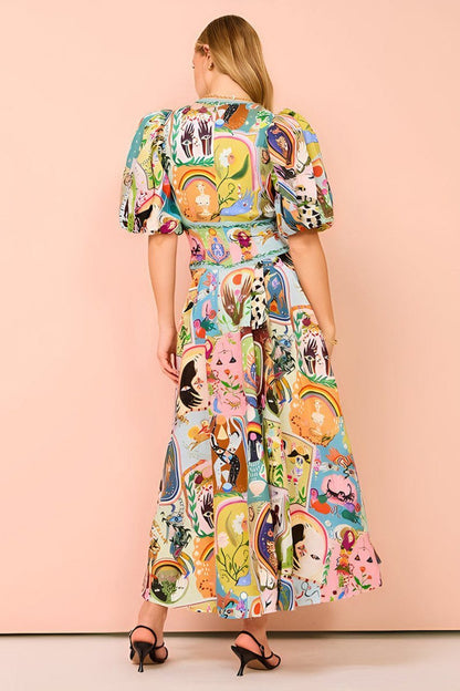 Woman in colorful printed cotton midi dress with puff sleeves