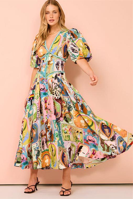 Woman in colorful printed cotton midi dress with puff sleeves