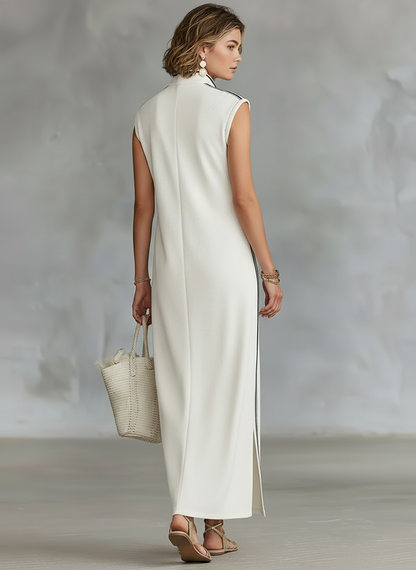 White - Sleeveless collared maxi dress with a front half-button placket, contrast side stripes, and side hem slits, styled with a woven tote bag and strappy sandals.