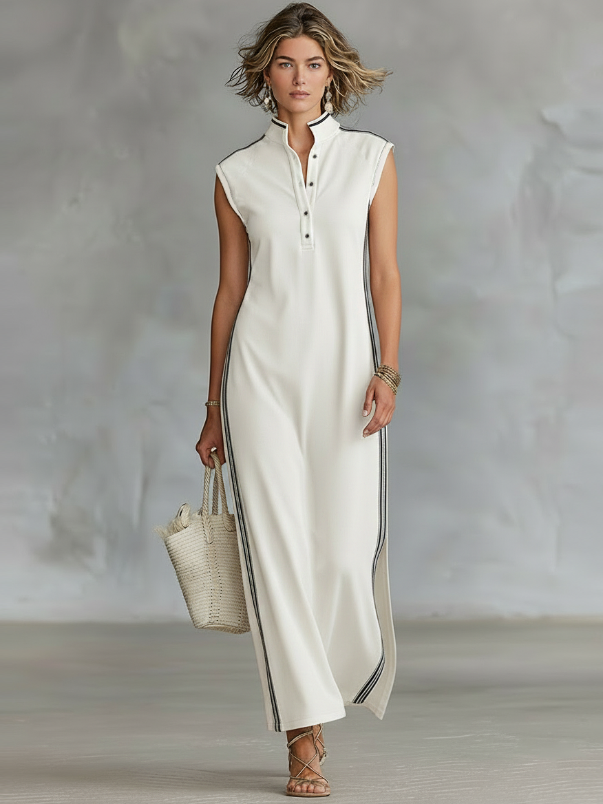 White - Sleeveless collared maxi dress with a front half-button placket, contrast side stripes, and side hem slits, styled with a woven tote bag and strappy sandals.