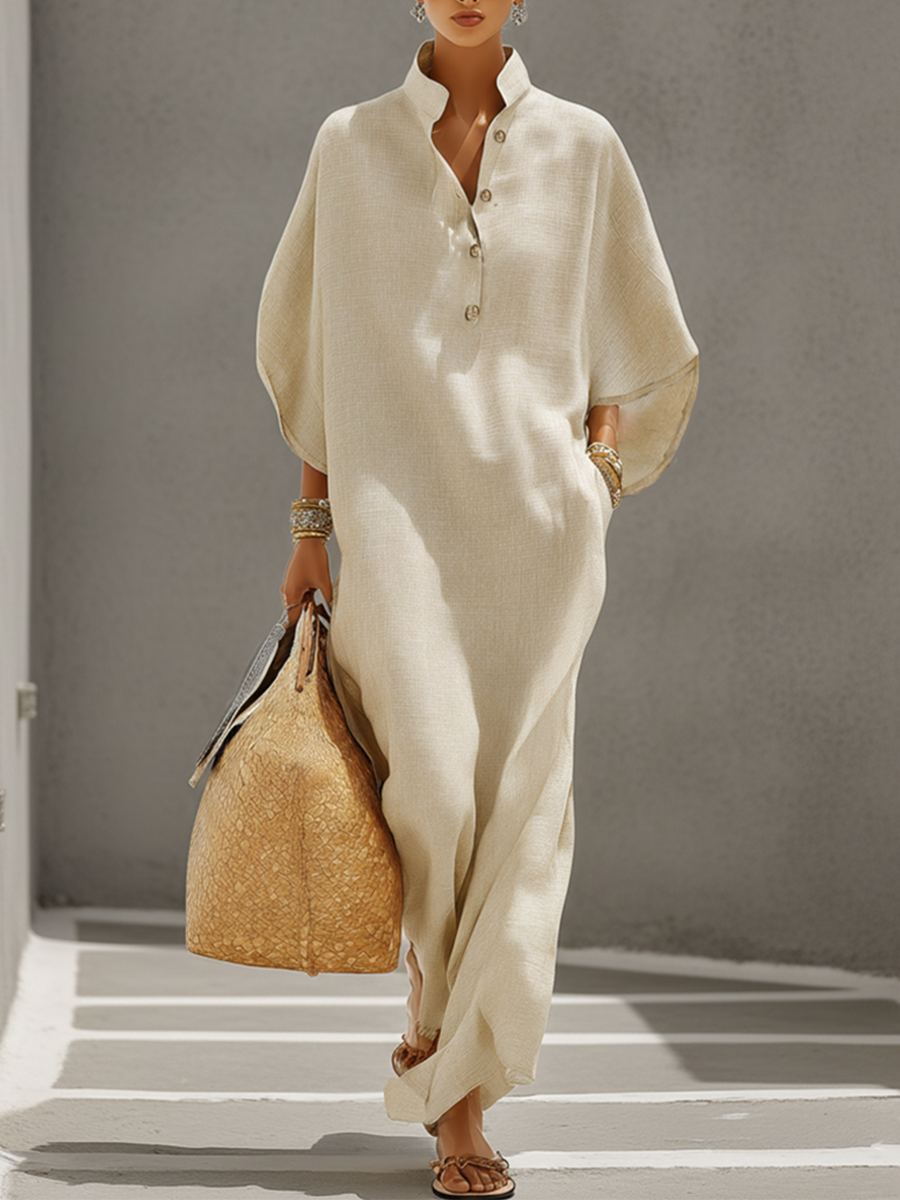 Oatmeal - Woman walking outdoors wearing a relaxed, oversized collared maxi dress with wide sleeves and a front button placket, carrying a woven tote bag.