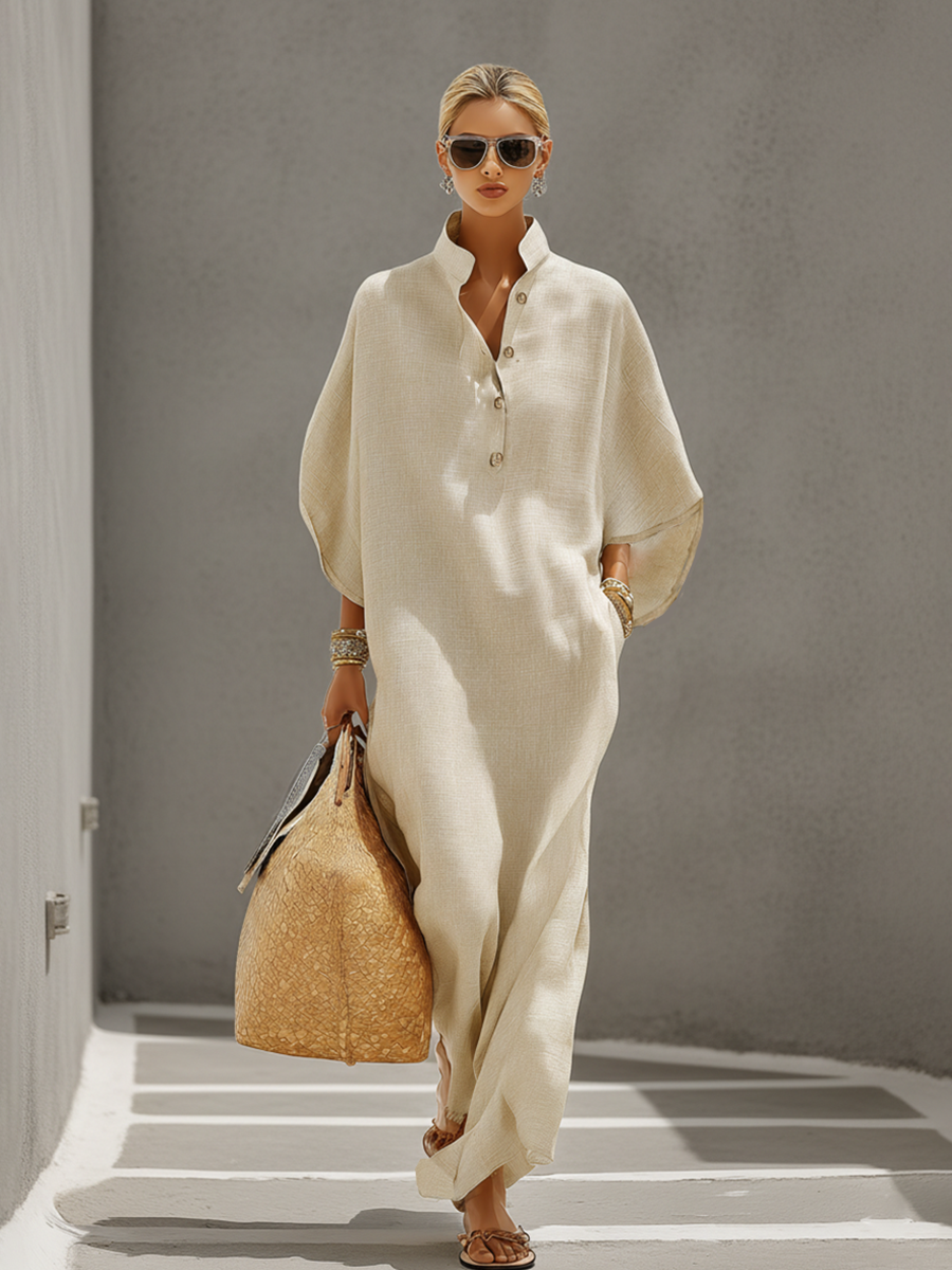Oatmeal - Woman walking outdoors wearing a relaxed, oversized collared maxi dress with wide sleeves and a front button placket, carrying a woven tote bag.