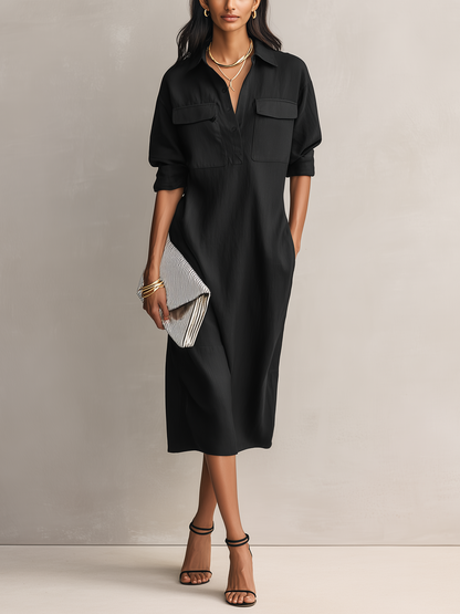 Black - Model wearing a relaxed fit, long-sleeve midi shirtdress with a collar, chest pockets, and side pockets against a neutral background.